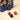 Vintage Dream Gingerbread Man tin in navy with star motifs, featuring three artisanal chocolates. - AI generated text