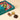 Open teal Vintage Dream Deluxe gift box with an assortment of fine chocolates, accompanied by three unwrapped pieces. - AI generated text