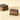 Two layered Cremino Espresso squares featuring rich hazelnut-toned bands and delicate, artisanal cocoa nibs. - AI generated text